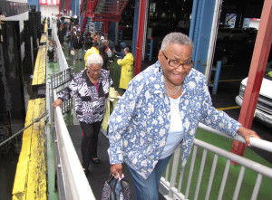 Grace Freeman, front, a New Community Manor Senior resident, and her friend, Jean Lightfoot, behind on ramp, boarded the Spirit of New York cruise ship at Chelsea Har- bor Pier 61.