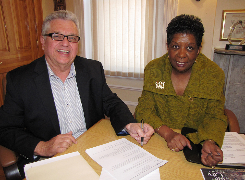 Richard Rohrman, left, CEO of New Community, with Diane Johnson, right, former director of the HUD Newark Field Office.