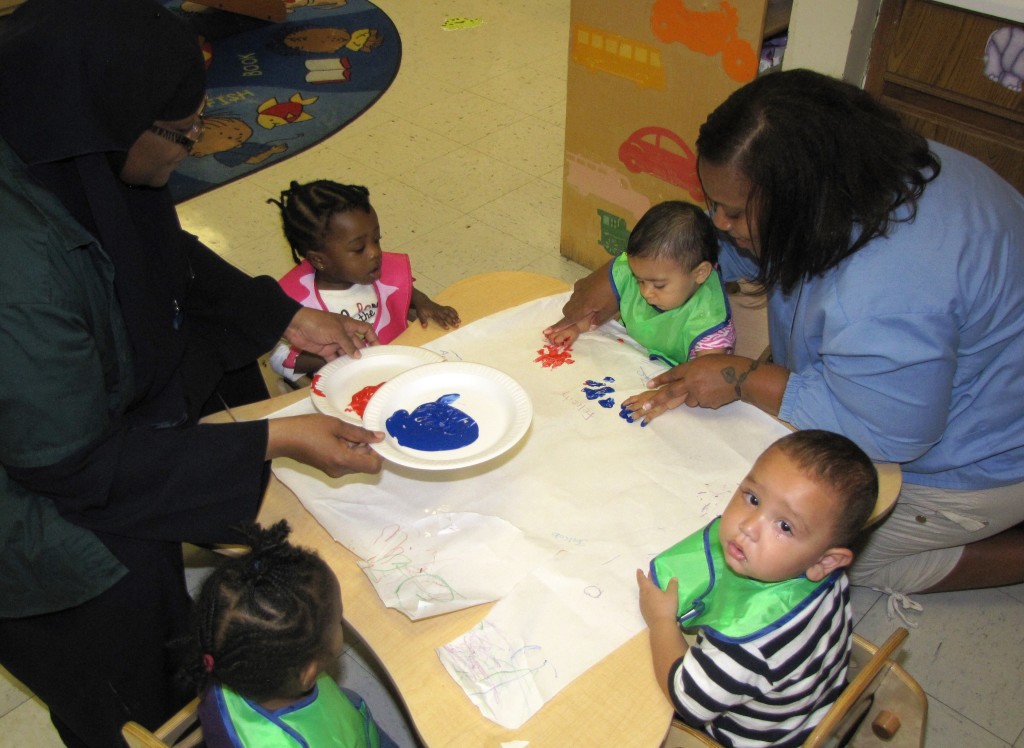 Even the youngest HHELC students, in the Infant Classroom, dabbled in the lesson by finger painting with the patriotic colors of red and blue.