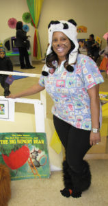 Lateisha Telfair, a veteran teacher at Community Hills Early Learning Center, dressed in costume for Family Literacy Night.