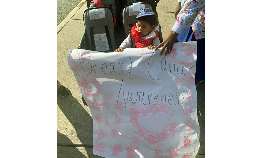 HHELC Breast Cancer Awareness March 2020 Infant with Sign for Website