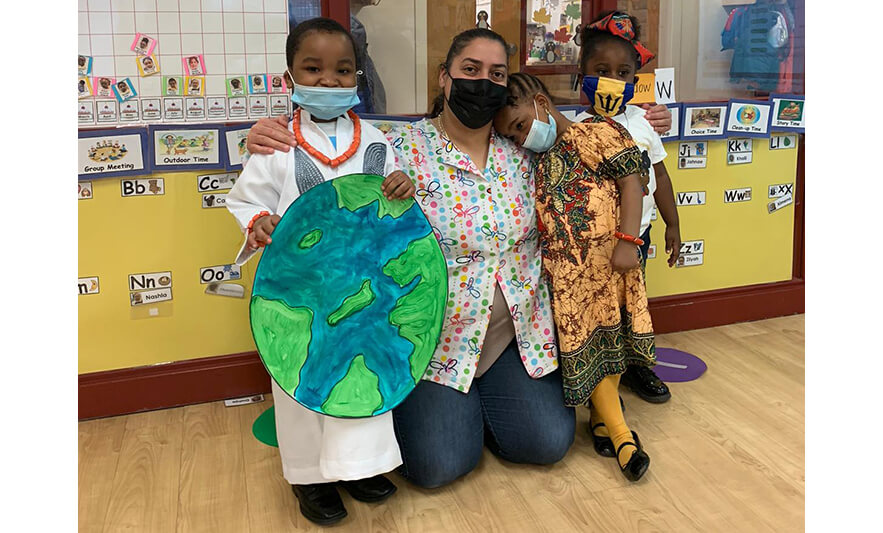 CHELC Black History Month 2022 Teacher with three students and paper globe for web