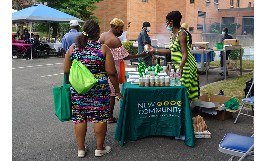 Extended Care Health Fair 7-29-2022 Family Resource Success Center handing out soda for web